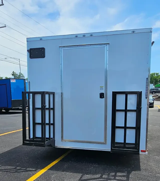 Exterior propane cylinder cages mounted on a white BJP concession trailer