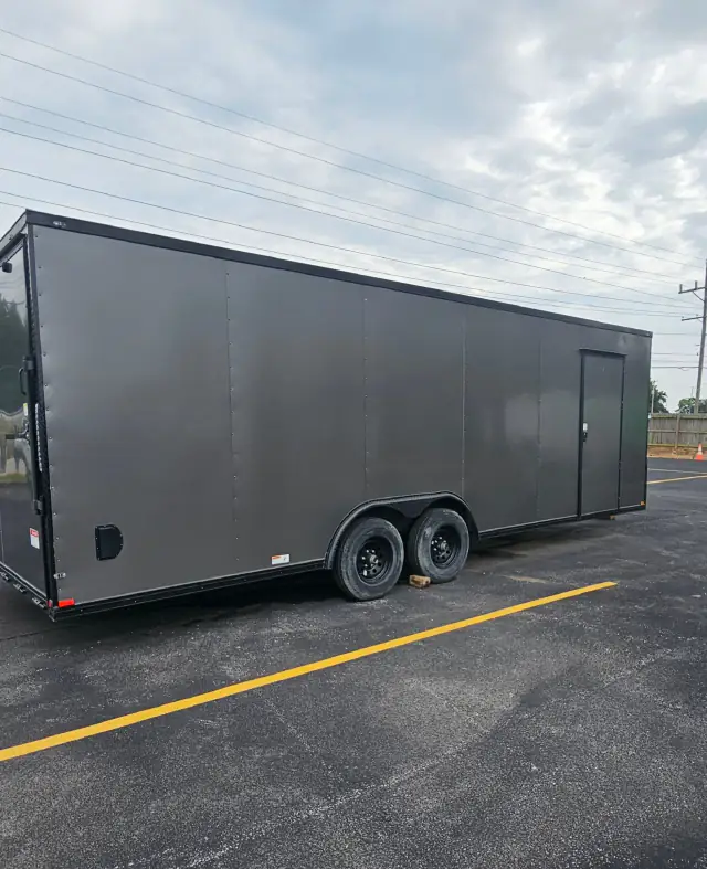 Silver BJP enclosed cargo trailer